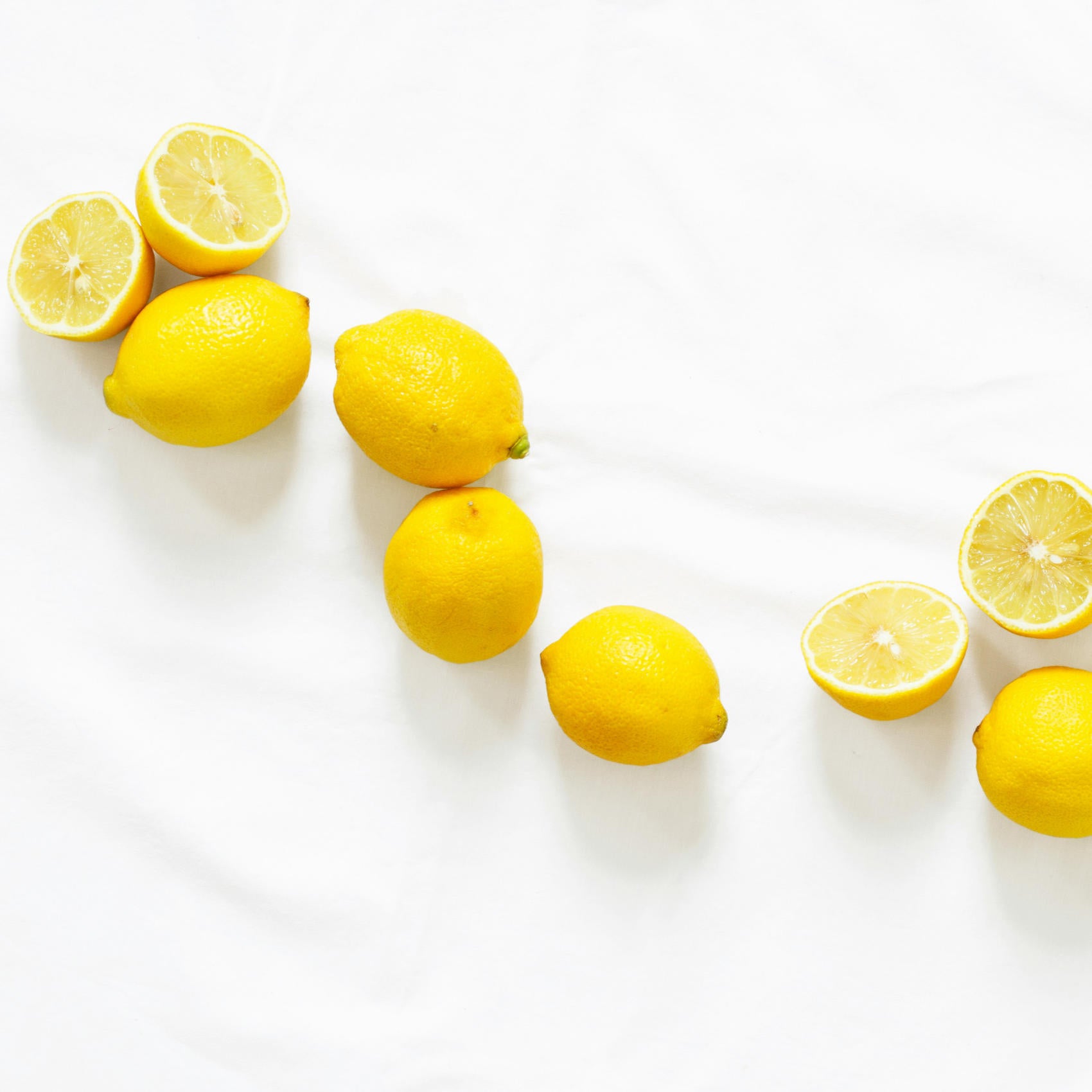 Selection of chopped and whole lemons.