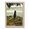 Black cat overlooking a misty landscape art print in a wooden frame. Portrait orientation