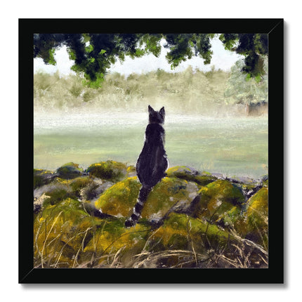 Black cat overlooking a misty landscape art print in a black frame