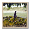 Black cat overlooking a misty landscape art print in a wooden frame