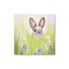 Brown rabbit peeking over the meadow flowers, drinks coasters