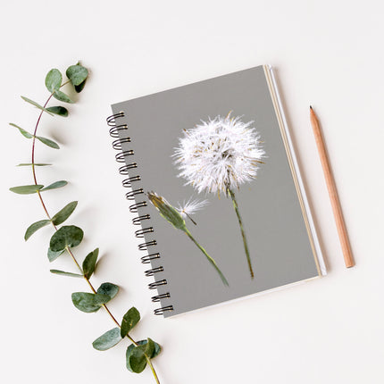 Dandelion seed artwork design spiral bound notebook. Grey and white cover design