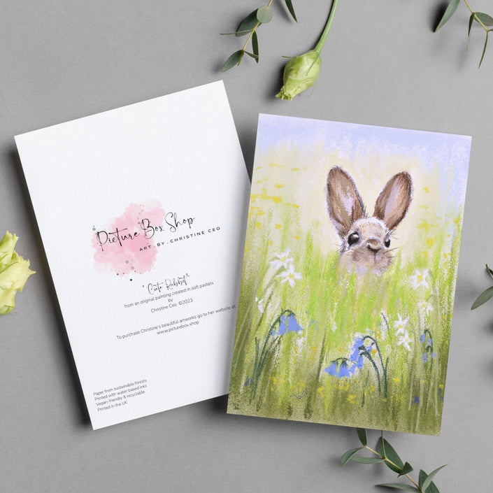 Cute brown rabbit peeping over the meadow flowers artwork greeting card. Front and back view