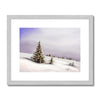 Snowy winter landscape fine art print in a silver frame with a white mount.