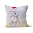 White rabbit throw cushion.