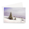 Delicate winter landscape with little fir trees covered in snow, art greeting card. Landscape orientation