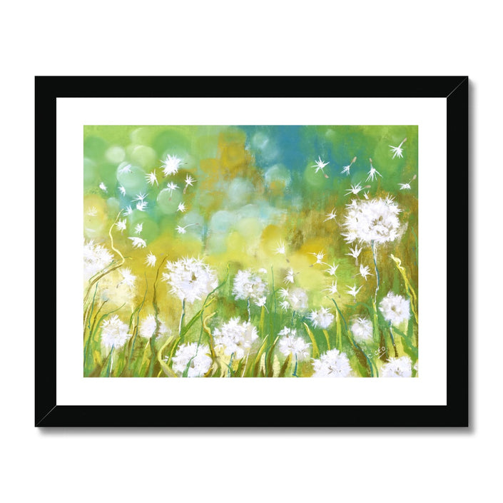 Dandelion seeds  and grasses artwork print in black frame. Landscape format.