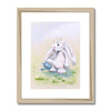 Cute rabbit and flowers wall art in a natural frame with white mount.