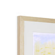  Fine art print with natural light wooden frame and a white mount. Top corner detail