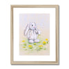 Rabbit nursery art print in natural frame with white mount.