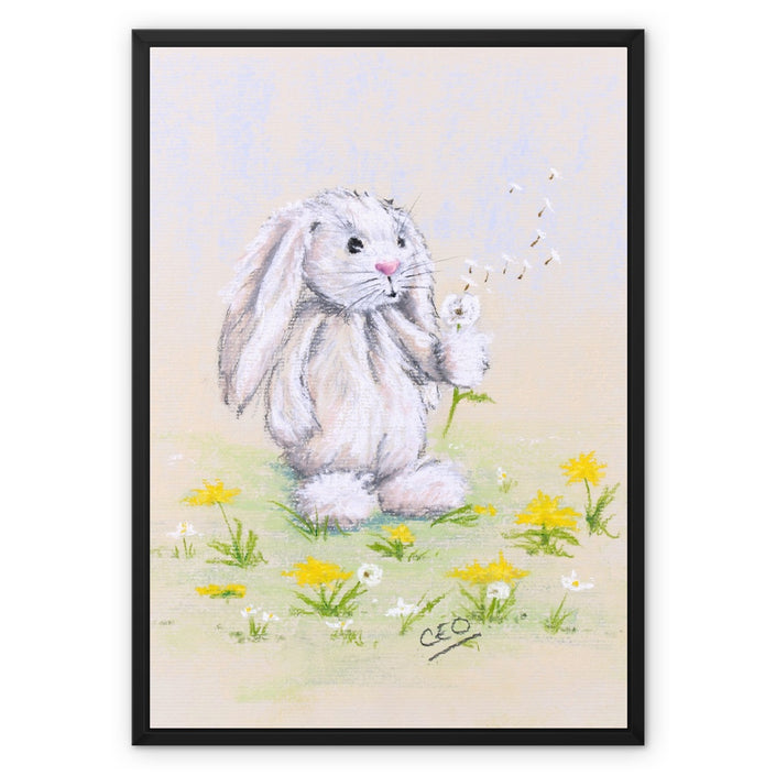 Beautiful rabbit and dandelions nursery artwork canvas print in black picture frame.