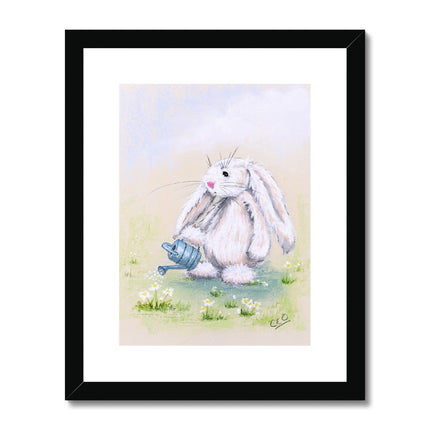 Beautiful white rabbit and watering can, nursery art print in black frame with white mount.