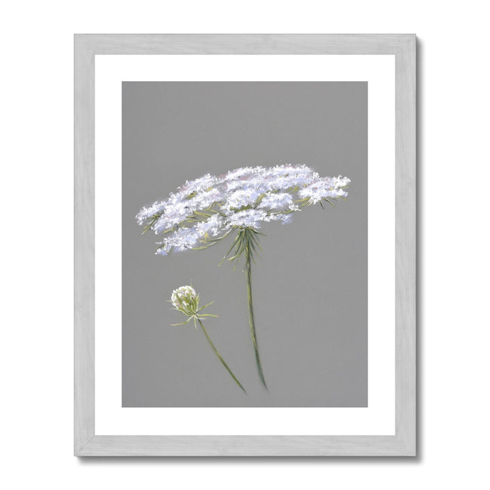 White and grey floral artwork print in silver frame