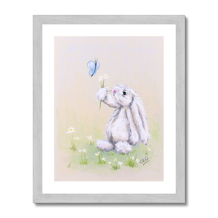 Beautiful rabbit, flowers and butterfly nursery art print in a silver frame. Portrait format.