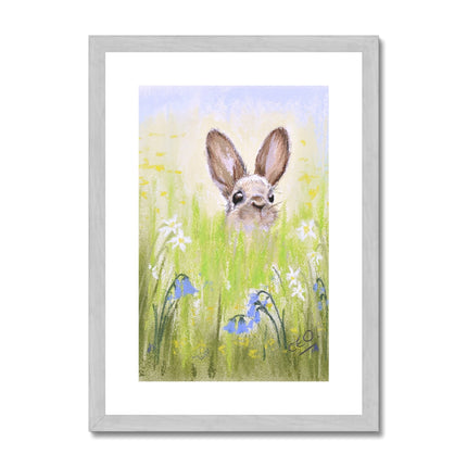 Cute Rabbit and meadow flowers art print in a silver frame with white mount.