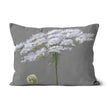 White flower on grey throw cushion. Rectangular