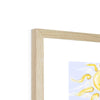 Fine art print with white border in a natural light wooden frame. Top corner detail