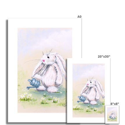 Adorable white rabbit watering the daisies with a little blue watering can artwork. Nursery fine art canvas prints. Different sizes. Eco and vegan-friendly wall art.