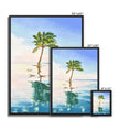 Palm tree set against blue sky and reflecting in clear turquoise water. Canvas fine art prints in a black frame. Different sizes