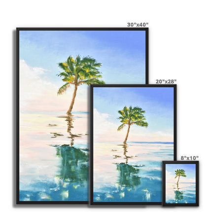 Palm tree set against blue sky and reflecting in clear turquoise water. Canvas fine art prints in a black frame. Different sizes