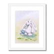 Adorable rabbit and watering can, artistic print in white frame with white mount.