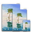 Palm tree set against blue sky and reflecting in clear turquoise water. Canvas wall art prints. Different sizes