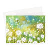 Fluffy white dandelion seed heads and seeds, floral landscape art greeting card. Landscape format