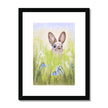 Rabbit in the meadow flowers artwork print with black frame and a white mount. 