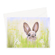 Cute brown rabbit peeping over the meadow flowers artwork greeting card. Horizontal format