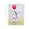 Adorable white rabbit floating above delicate flowers from a balloon, artwork greeting card. Portrait orientation