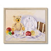 Golden-brown teddy bear and white fluffy bunny are surrounded by silken ribbon and Christmas Baubles, fine art print in a natural frame