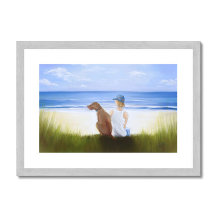 A Boy and His Dog at the beach painting. Fine art print in a silver frame. Landscape orientation