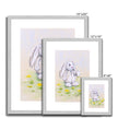 Adorable rabbit and dandelions artwork prints in a silver frame with white mount. Different sizes