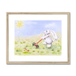 Adorable white rabbit in meadow flowers. Art print in wooden frame with a white mount. 