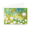 Fluffy white dandelion seeds heads art greeting card. Landscape format